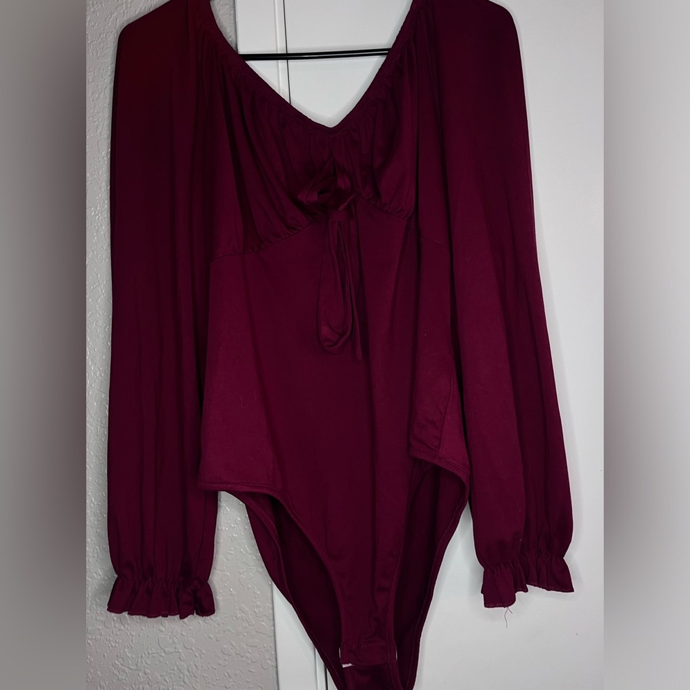 Burgundy long sleeve bodysuit.